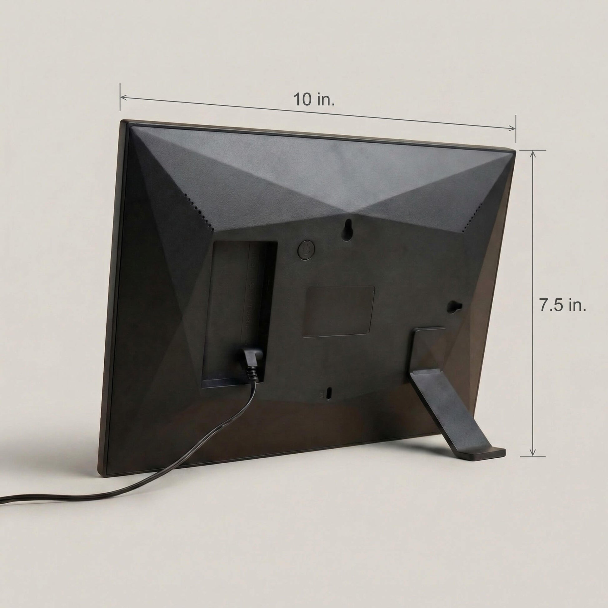 The sleek matte rear casing of a 10-inch black Family Frame digital picture frame, demonstrating its clean hardware dimensions and durable built-in kickstand. The engineered design of this corded electronic photo frame provides perfect stability for proudly displaying memories on any flat surface. This state-of-the-art HD digital photo display offers an elegant aesthetic that enhances home decor while connecting separated families.
