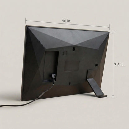 The sleek matte rear casing of a 10-inch black Family Frame digital picture frame, demonstrating its clean hardware dimensions and durable built-in kickstand. The engineered design of this corded electronic photo frame provides perfect stability for proudly displaying memories on any flat surface. This state-of-the-art HD digital photo display offers an elegant aesthetic that enhances home decor while connecting separated families.
