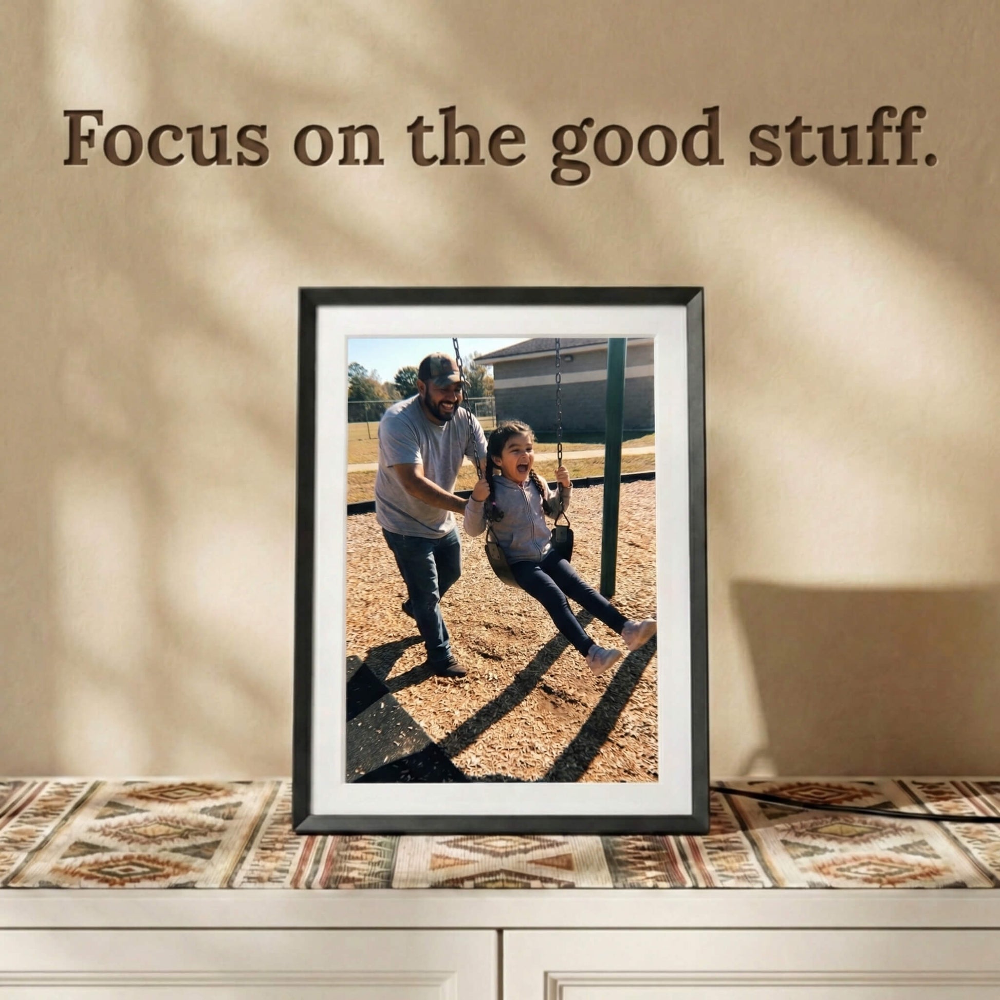 A 10-inch classic black Family Frame smart picture frame featuring a white mat, standing on a bohemian-styled credenza. Designed for vivid visual storytelling, this WiFi photo frame delivers a stunning high-resolution display that beautifully highlights the details of every uploaded image. Acting as a dedicated digital memory display, it bridges the physical distance between family members with a constant stream of new photos.
