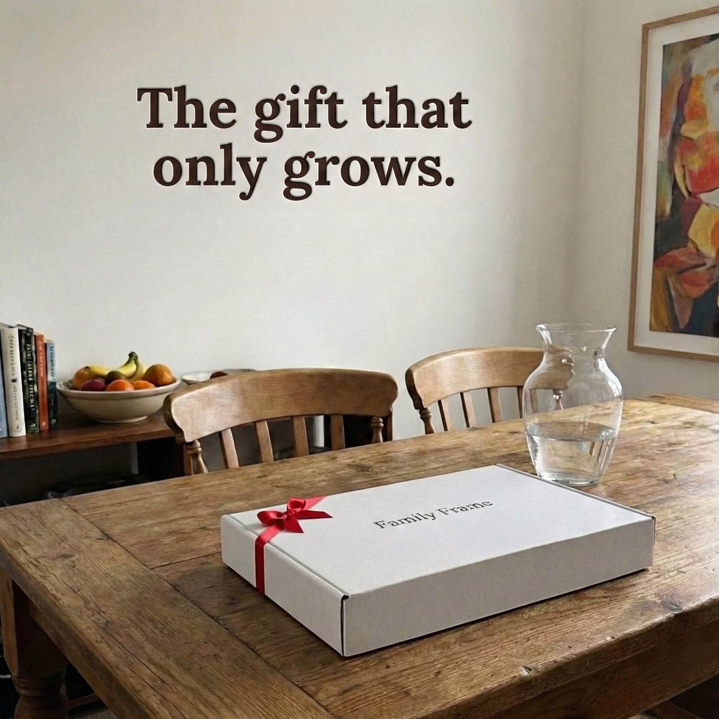 A 10-inch oak wood Family Frame smart picture frame packaged elegantly in a premium white gift box with a red bow, sitting on a solid wood dining table. Perfectly presented as a luxury long-distance family gift, this beautifully boxed WiFi photo frame is built to foster daily emotional connections. The premium electronic photo frame serves as a continuous digital memory display, updating effortlessly through its dedicated secure application.
