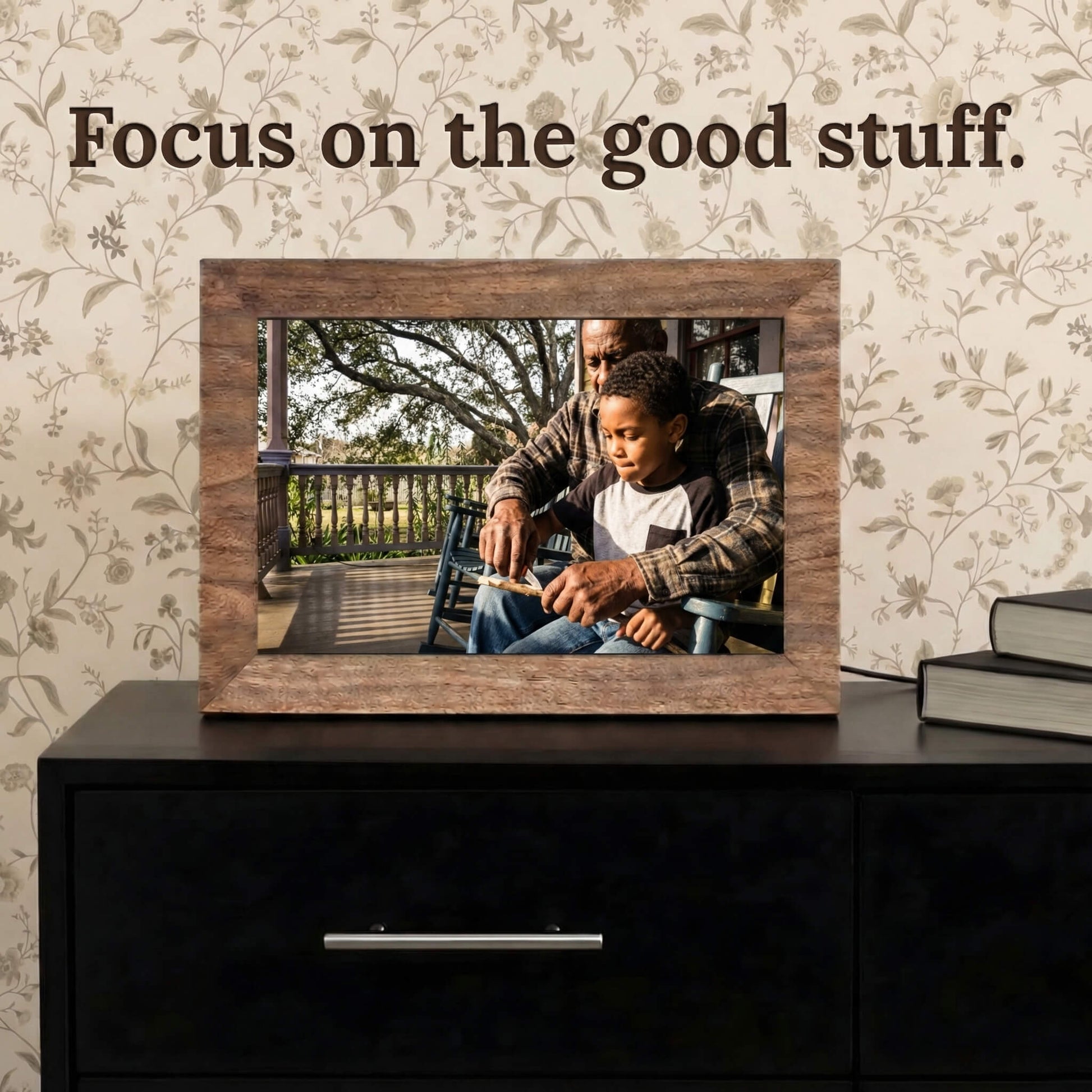 A 10-inch oak wood Family Frame smart picture frame situated on a dark modern dresser against patterned wallpaper. Engineered for vivid visual storytelling, this WiFi photo frame delivers a stunning high-resolution display that beautifully highlights the intricate details of every uploaded image. Acting as an impressive digital memory display, it bridges the physical distance between family members with a constant stream of new photos.
