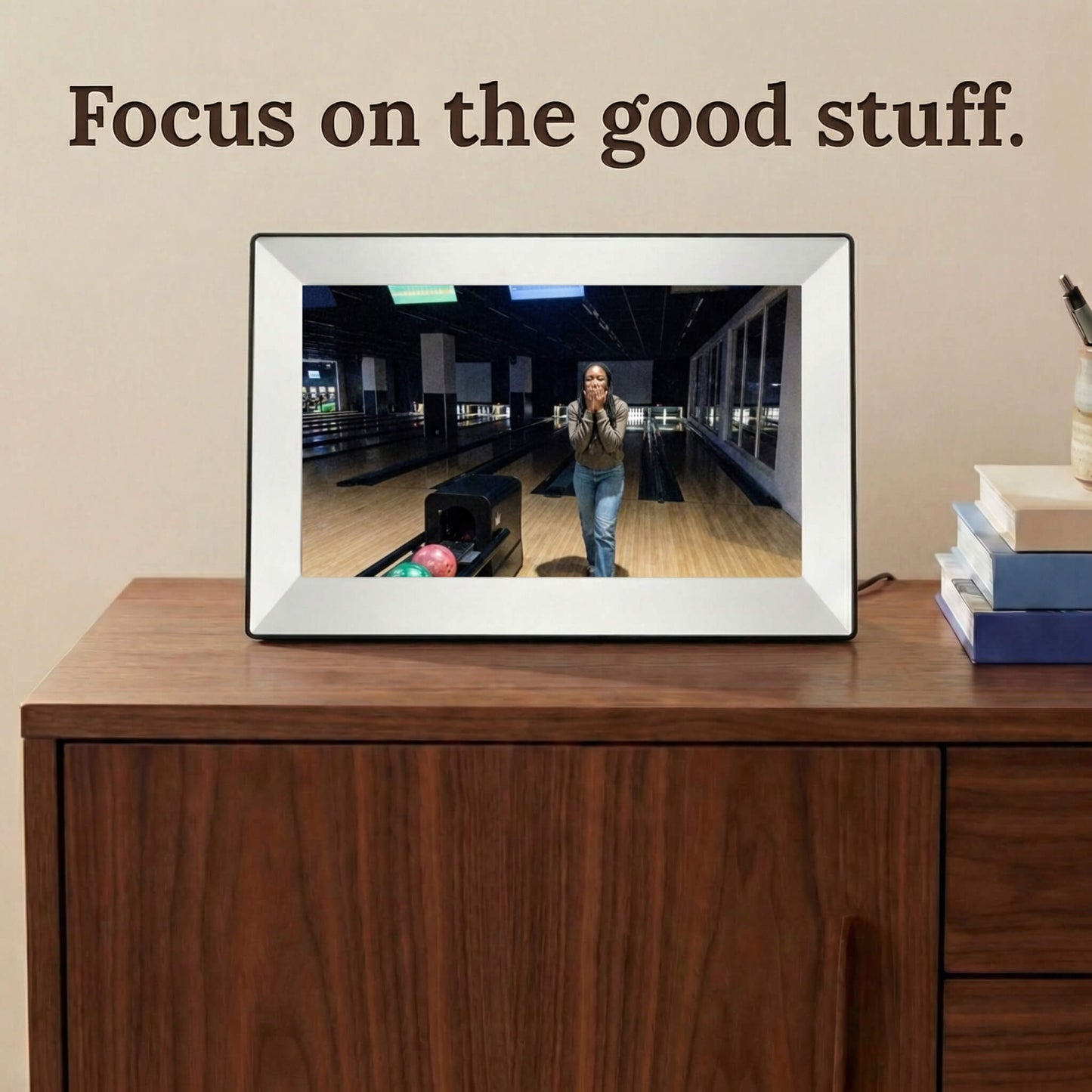 A 10-inch white Family Frame smart picture frame situated on a mid-century wooden dresser, showcasing crisp image quality. This high-resolution electronic photo frame enhances everyday moments through an advanced HD digital photo display that auto-adjusts to room lighting. Acting as a dedicated digital memory display, it bridges the gap between relatives by sharing everyday updates instantly.
