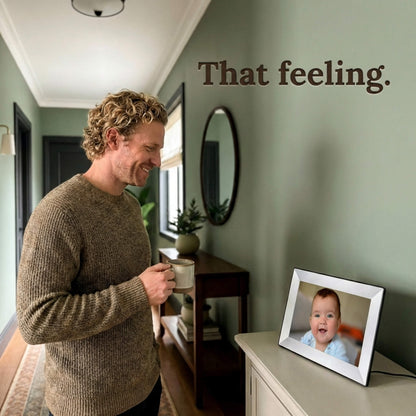 A 10-inch white Family Frame WiFi photo frame placed on an entryway console table in a brightly lit room. This easy setup smart frame triggers moments of unexpected joy by receiving fresh photos instantly from friends and family anywhere in the world. As a premium long-distance family gift, it provides a secure, private photo sharing experience with no hidden costs.
