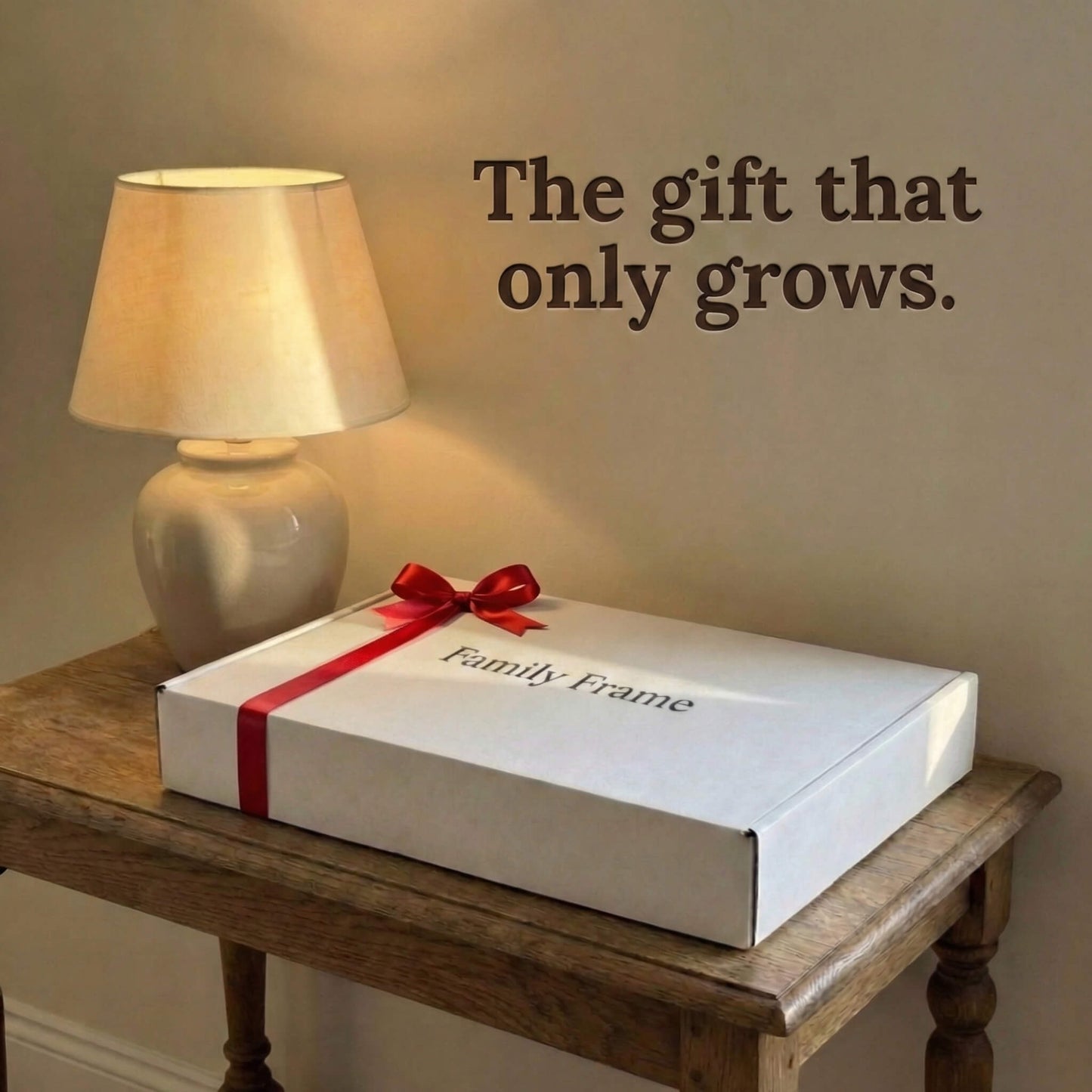 A 16-inch studio black Family Frame smart picture frame packaged securely in a premium branded white gift box adorned with a red ribbon, resting on a vintage side table. Packaged beautifully to be the ultimate long-distance family gift, this WiFi photo frame is ready to deliver an out-of-the-box experience of pure connection. This top-tier electronic photo frame allows for easy photo pre-loading so families can start sharing memories instantly.
