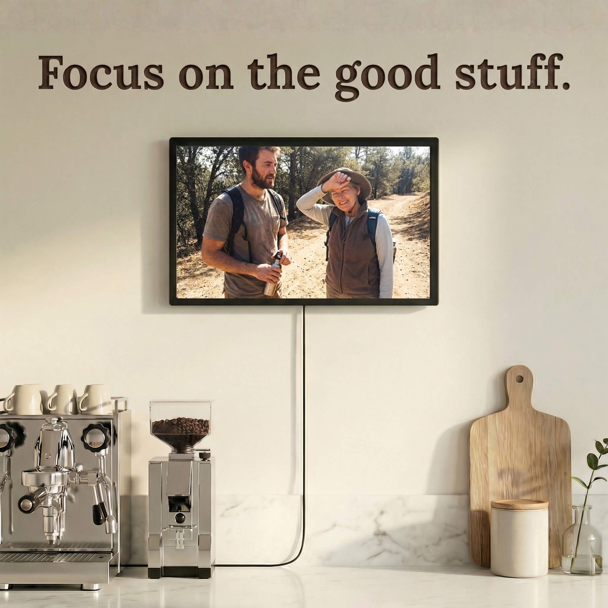 A 20-inch black Family Frame smart picture frame mounted beautifully above a modern home espresso station. Engineered for vivid visual storytelling, this large WiFi photo frame delivers a stunning high-resolution display that beautifully highlights the intricate details of every uploaded image. Acting as an impressive digital memory display, it bridges the physical distance between family members with a constant stream of new photos.
