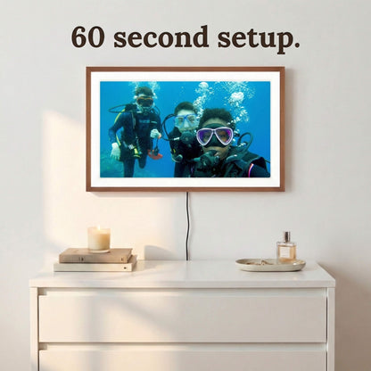A 20-inch oak wood Family Frame electronic photo frame featuring a clean white mat, mounted seamlessly above a white bedroom dresser. Prioritizing accessibility, this impressive smart picture frame boasts a frictionless, easy 60-second WiFi setup process using the included remote control. This no subscription fee digital frame ensures immediate and uninterrupted photo sharing for families of all technical backgrounds.
