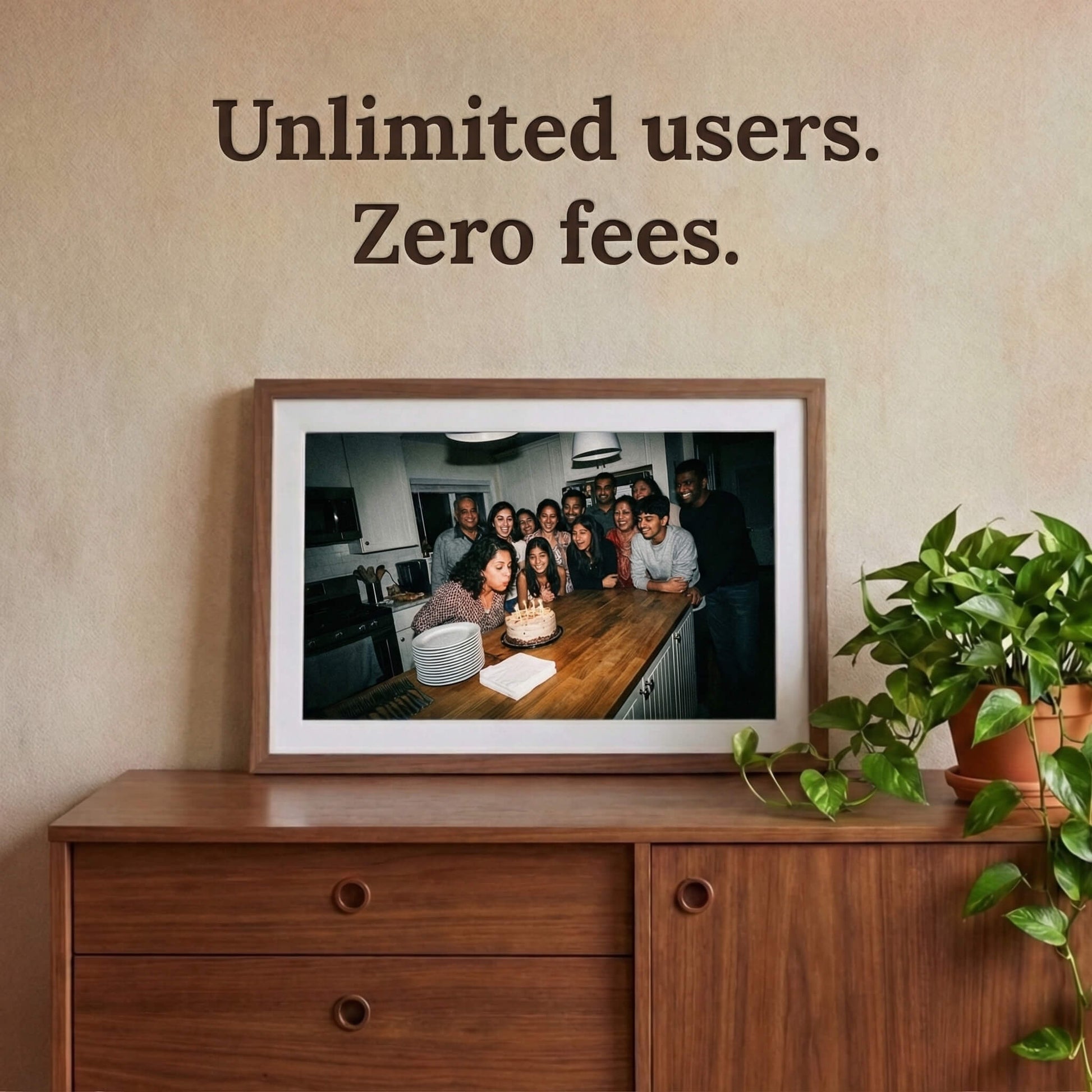 A 20-inch oak wood Family Frame digital picture frame with a clean white mat mounted prominently above a retro wooden credenza surrounded by lush plants. Built to gather the whole family, this expansive smart picture frame securely accepts photo uploads from an unlimited number of invited users around the globe. Operating entirely as a no subscription fee digital frame, it represents the most cost-effective way to maintain long-distance family connections over time.
