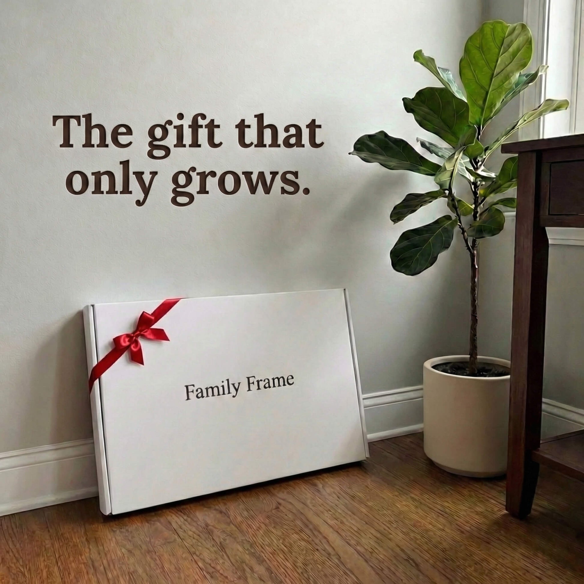A 20-inch oak wood Family Frame smart picture frame packaged elegantly in a massive white gift box with a red bow, resting on a hardwood floor beside a potted plant. Perfectly presented as a luxury long-distance family gift, this beautifully boxed WiFi photo frame is built to foster daily emotional connections. The premium electronic photo frame serves as a continuous digital memory display, updating effortlessly through its dedicated secure application.
